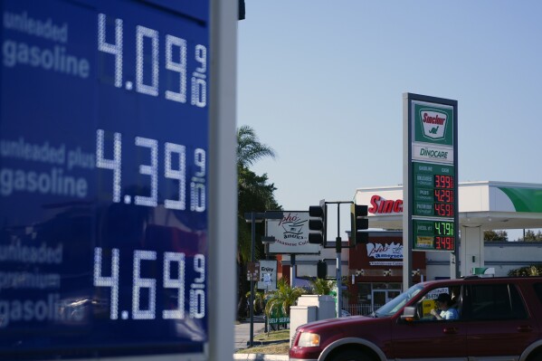 FILE - A sign at a Sinclair gas station is seen next to an Arco gas station advertising gasoline prices, June 10, 2024, in Long Beach, Calif. (AP Photo/Ryan Sun, File)