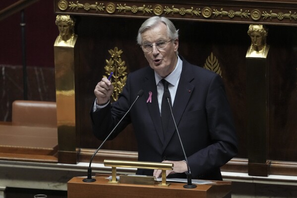 France's Prime Minister Michel Barnier delivers a speech at the National Assembly, in Paris, Tuesday, Oct. 1, 2024. (AP Photo/Thibault Camus)