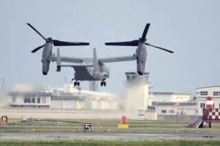 FILE - A U.S. military CV-22 Osprey takes off from Iwakuni base, Yamaguchi prefecture, western Japan, on July 4, 2018. Japanese and American military divers have spotted what could be the remains of a U.S. Air Force Osprey aircraft that crashed last week off southwestern Japan and several of the six crewmembers who are still missing, local media reported Monday, Dec. 4, 2023. (Kyodo News via AP, File)