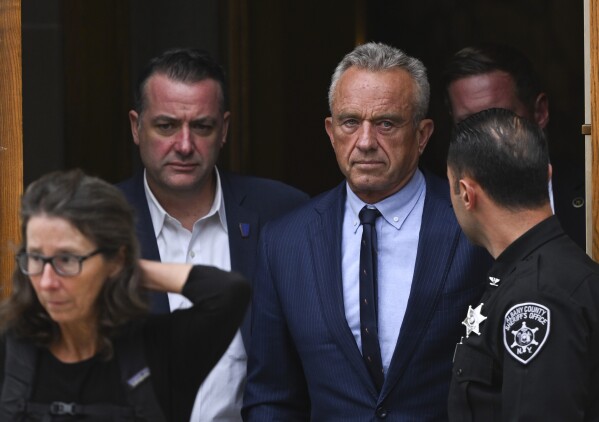 FILE - Independent presidential candidate Robert F. Kennedy Jr., center right, leaves the Albany County Courthouse, Aug. 6, 2024, in Albany, N.Y. (AP Photo/Hans Pennink, File)