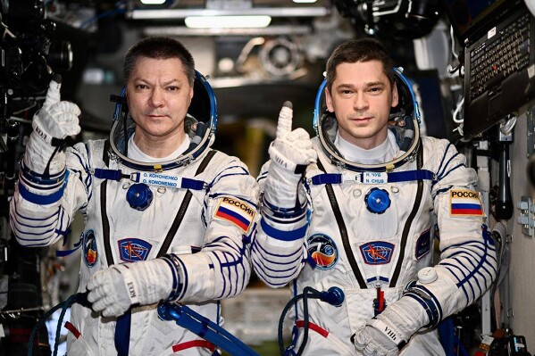 In this undated photo released by Roscosmos space corporation, Russians Oleg Kononenko and Nikolai Chub are shown aboard the International Space Station on Friday, Sept. 20, 2024. They set the record for the longest continuous presence on the ISS, more than 370 days. (Roscosmos space corporation via AP)