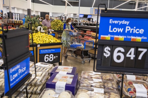 FILE - People buy groceries at a Walmart Superstore in Secaucus, New Jersey, July 11, 2024. (AP Photo/Eduardo Munoz Alvarez, File)