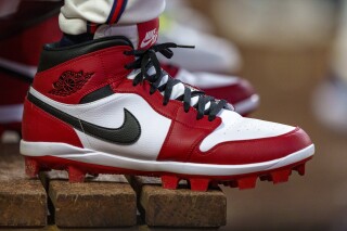 FILE - Atlanta Braves outfielder Jorge Soler wears custom Nike Air Jordan cleats in the dugout during the seventh inning of a baseball game against the Colorado Rockies, Sept. 5, 2024, in Atlanta. (AP Photo/Jason Allen, File)