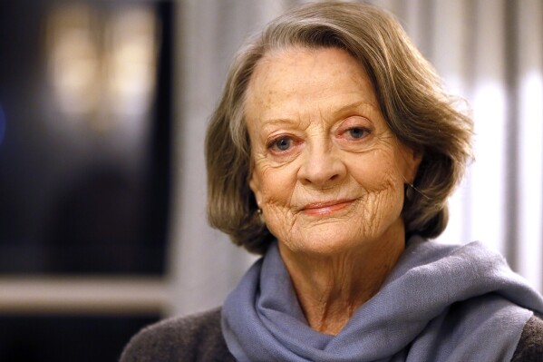 FILE - British actress Dame Maggie Smith poses in London on Dec. 16, 2015. Smith, who won an Oscar for “The Prime of Miss Jean Brodie” in 1969 and won new fans in the 21st century as the dowager Countess of Grantham in “Downton Abbey,” has died at 89. (AP Photo/Kirsty Wigglesworth, File)