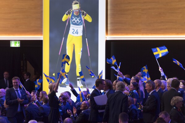 FILE - Stockholm-Are delegation members celebrate during the presentation final presentation of the Stockholm-Are candidate cities the first day of the 134th Session of the International Olympic Committee (IOC), at the SwissTech Convention Centre, in Lausanne, on June 24, 2019. Sweden is moving closer to a ninth bid to host the Winter Olympics for the first time in what's shaping up to be a race for the 2030 Games with only one obvious candidate. Swedish sports officials say there's a desire for the Nordic country to stage the Olympics following a four-month feasibility study. (Laurent Gillieron/Keystone via AP, File)