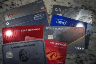 FILE - A variety of credit cards are shown on Jan. 18, 2024, in Atlanta. Seriously overdue credit card debt is at the highest level in 14 years, and people 35 and under are struggling more than other age groups to pay their bills. (AP Photo/Mike Stewart, File)