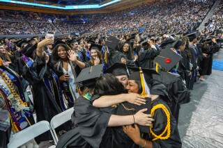 FILE - UCLA students celebrate during a commencement ceremony inside Pauley Pavilion on UCLA campus, in Los Angeles, June 14, 2024. (AP Photo/Damian Dovarganes, File)