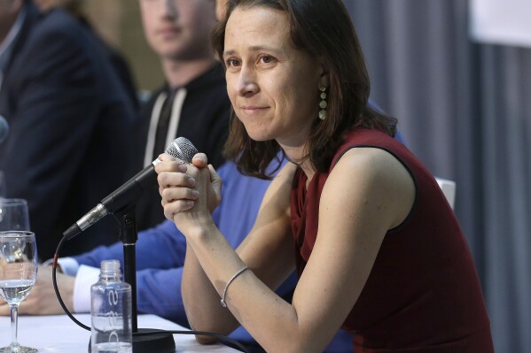 FILE - 23andMe CEO Anne Wojcicki speaks at an announcement for the Breakthrough Prize in Life Sciences at Genentech Hall on UCSF's Mission Bay campus in San Francisco, Feb. 20 2013. (AP Photo/Jeff Chiu, File)