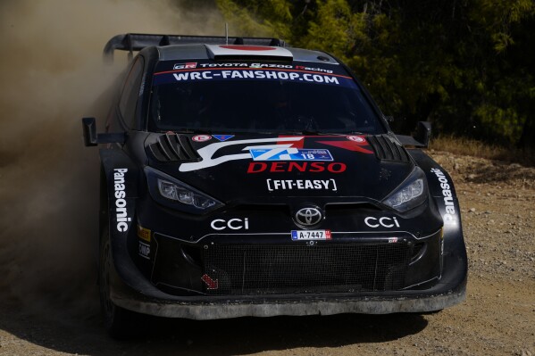 Japan's Takamoto Katsuta and his Irish co-driver Aaron Johnston with Toyota GR Yaris Rally1 Hybrid, compete during a special stage of WRC Acropolis Rally in Thiva, some 90 kilometers (56 miles) north of Athens, Greece, Saturday, Sept. 7, 2024. (AP Photo/Thanassis Stavrakis)