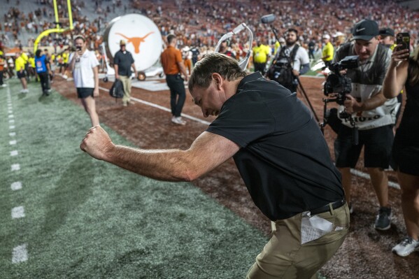 Georgia head coach Kirby Smart celebrates with Georgia fans cheering from the stands after defeating Texas during an NCAA college football game in Austin, Texas, Saturday, Oct. 19, 2024. (AP Photo/Rodolfo Gonzalez)