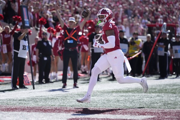 Indiana wide receiver Myles Price (4) scores a touchdown against Nebraska during the first half of an NCAA college football game in Bloomington, Ind., Saturday, Oct. 19, 2024. (AP Photo/AJ Mast)