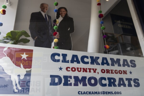 A sign is displayed at the Clackamas County Democratic party building, which is in Oregon's 5th Congressional District, on Friday, May 17, 2024, in Oregon City, Ore. Two Democratic primaries for U.S. House seats in Oregon could help reveal whether the party's voters are leaning more toward progressive or establishment factions. Candidates running in the state's 3rd and 5th Congressional Districts largely share similar policy platforms. (AP Photo/Jenny Kane)