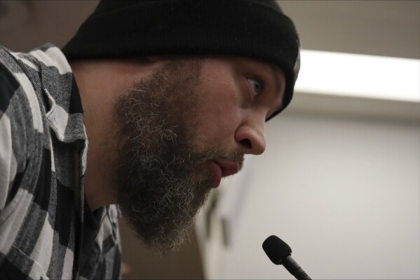 Eric Childs, the father of a transgender child boy, testifies against a South Carolina bill banning medical care for transgender minors in Columbia, S.C. on Jan. 9, 2024. The proposal advanced Wednesday out of committee for the consideration of the entire South Carolina House. (AP Photo/James Pollard)