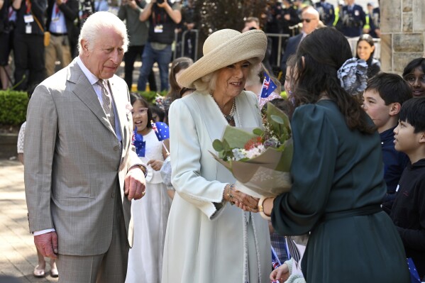 King Charles III, left, and Queen Camilla, center, greet people during a visit to St Thomas' Anglican Church in Sydney, Sunday, Oct. 20, 2024. (Dean Lewins/Pool Photo via AP)