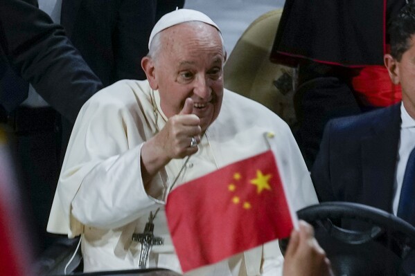 FILE -Pope Francis cheers at the participants as he arrives to preside over a mass at the Steppe Arena in the Mongolian capital Ulaanbaatar, Sept. 3, 2023. (AP Photo/Ng Han Guan, File)