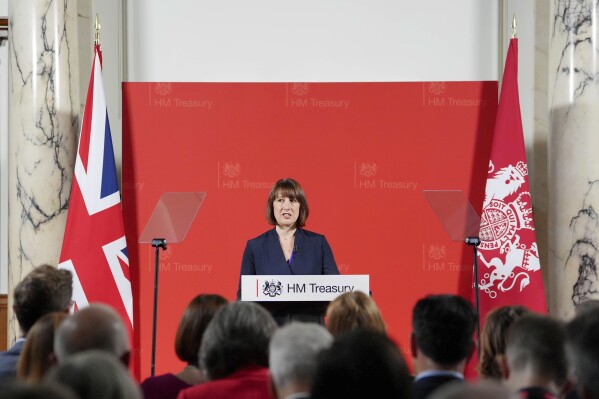 Britain's Chancellor Rachel Reeves delivers a speech at the Treasury to an audience of leading business figures and senior stakeholders, announcing the first steps the new government will be taking to deliver economic growth, in London, Monday July 8, 2024. (Jonathan Brady/Pool Photo via AP)