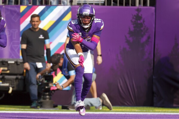 Minnesota Vikings wide receiver Justin Jefferson (18) celebrates his 25-yard touchdown reception during the second half of an NFL football game Sunday, Oct. 20, 2024, in Minneapolis. (AP Photo/Bruce Kluckhohn)