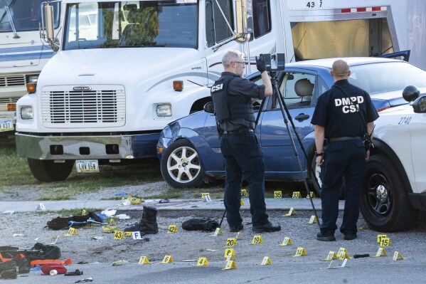 FILE - Crime scene investigators work at the scene where two Des Moines police officers were shot and the suspected shooter was killed by officers in an exchange of gunfire in Des Moines, Iowa, early, Sept. 16, 2024. (Cody Scanlan/The Des Moines Register via AP, file)