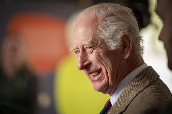 Britain's King Charles III smiles during his visit to the Forsinard Flows Visitor Centre in Forsinard, Highland, Scotland, July 31, 2024. (Jane Barlow/Pool Photo via AP, File)