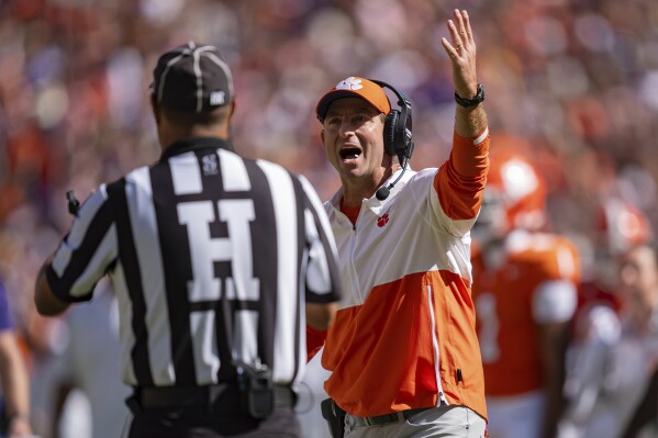 Clemson head coach Dabo Swinney reacts towards an official in the first half of an NCAA college football game against Virginia, Saturday, Oct. 19, 2024, in Clemson, S.C. (AP Photo/Jacob Kupferman)