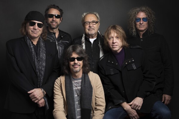 FILE - Thom Gimbel, from left, Michael Bluestein, Mick Jones, Kelly Hansen, Jeff Pilson and Bruce Watson of Foreigner pose for a portrait during the Sundance Film Festival in Park City, Utah on Jan. 20, 2017. (Photo by Taylor Jewell/Invision/AP, File)