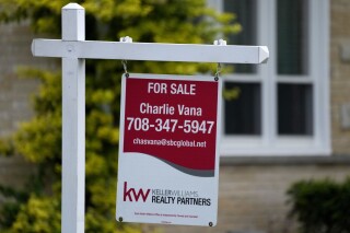 FILE - A for sale sign is displayed in front of a home in Wheeling, Ill., on May 2, 2024. (AP Photo/Nam Y. Huh, File)