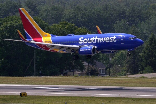 FILE - Southwest Airlines Boeing 737 lands at Manchester Boston Regional Airport, June 2, 2023, in Manchester, N.H. Southwest Airlines reports their earnings on Thursday, Jan. 25, 2024. (AP Photo/Charles Krupa, File)