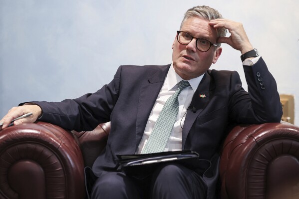 British Prime Minister Keir Starmer speaks to members of the media in Rome, Monday, Sept. 16, 2024. (Phil Noble/Pool Photo via AP)