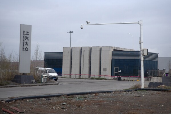 FILE - An SAIC Volkswagen plant is seen in the outskirts of Urumqi in northwestern China's Xinjiang Uyghur Autonomous Region, Thursday, April 22, 2021. A new report says automakers including Tesla, General Motors, Volkswagen and Toyota are failing to ensure they are not using forced labor as part of their China supply chains. (AP Photo/Mark Schiefelbein, File)