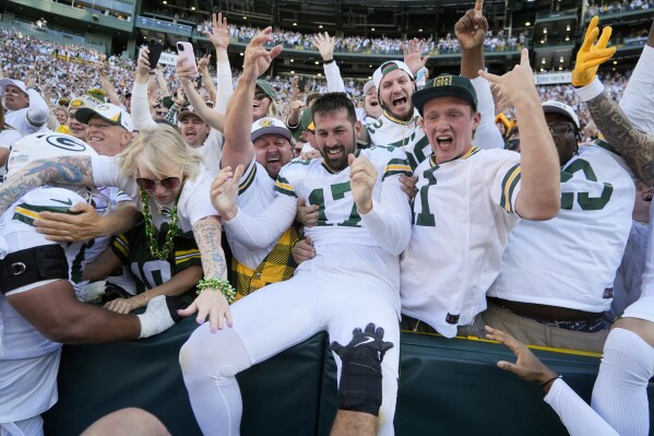 Green Bay Packers place kicker Brandon McManus (17) celebrates with fans after kicking the game-winning field goal in the second half of an NFL football game, Sunday, Oct. 20, 2024, in Green Bay, Wis. The Packers won 24-22. (AP Photo/Morry Gash)