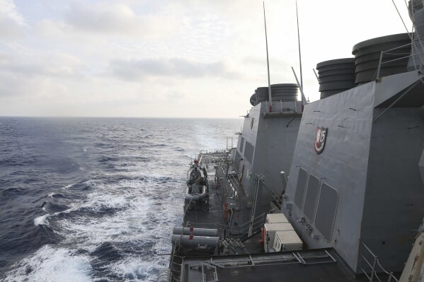 In this photo provided by the U.S. Navy, the Arleigh Burke-class guided-missile destroyer USS Milius (DDG 69) conducts routine underway operations in South China Sea, Friday March 24, 2023. (Mass Communication Specialist 1st Class Greg Johnson/U.S. Navy via AP)