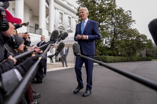 FILE - President Joe Biden speaks to members of the media before boarding Marine One on the South Lawn of the White House in Washington, Jan. 30, 2024. U.S. adults are only feeling slightly better about the economy, despite stocks being near record highs and surprisingly strong growth last year. A new poll from The Associated Press-NORC Center for Public Affairs Research finds that 35% of U.S. adults call the national economy good. (AP Photo/Andrew Harnik, File)