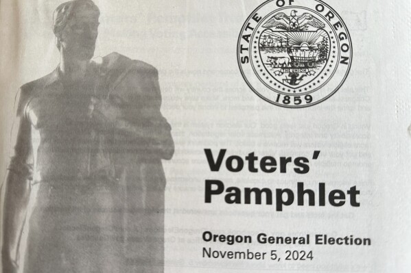 A Voters' Pamphlet for the Oregon General Election on November 5, 2024, is shown on Thursday, Oct. 17, 2024, in Oregon. (AP Photo/Gillian Flaccus)