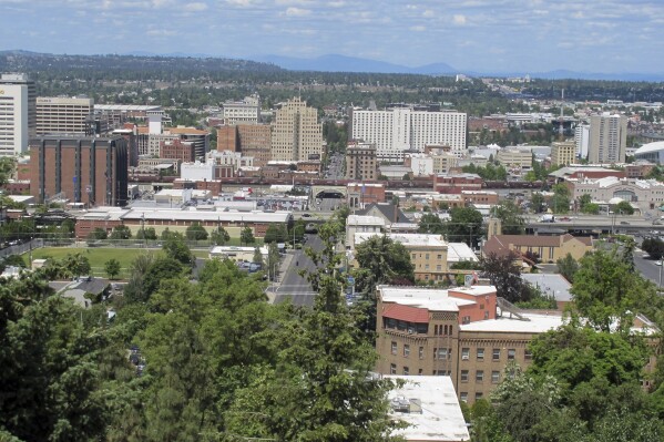 FILE - The downtown skyline is shown from the South Hill in Spokane, Wash., on June 4, 2018. The American Civil Liberties Union of Washington has sued the city of Spokane, alleging that its anti-homeless laws violate the state constitution. The group filed the suit on Thursday, Aug. 1, 2024, on behalf of a currently homeless person and someone who was formerly homeless. (AP Photo/Nicholas K. Geranios, File)