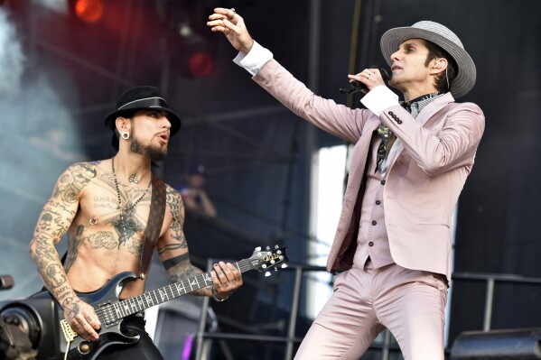 FILE - Dave Navarro, left, and Perry Farrell of Jane's Addiction perform at Lollapalooza on July 30, 2016, in Chicago. (Photo by Rob Grabowski/Invision/AP, File)