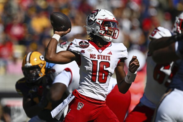 NC State quarterback CJ Bailey (16) looks to pass against California during the first half of an NCAA college football game at Memorial Stadium in Berkeley, Calif., Saturday, Oct. 19, 2024. (Jose Carlos Fajardo/Bay Area News Group via AP)