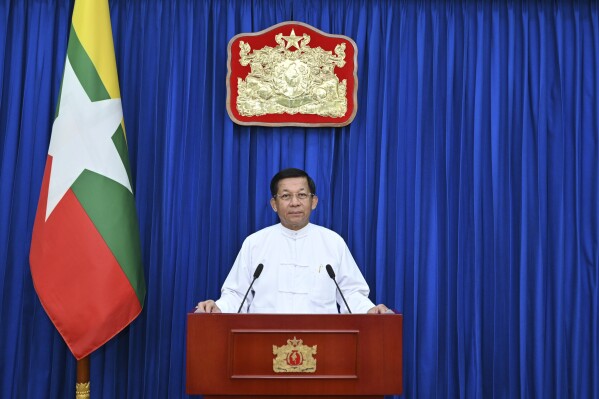 In this photo released by Myanmar Military True News Information Team, Senior General Min Aung Hlaing, the Myanmar military leader, delivers video speech to mark the 9th anniversary of signing Nationwide Ceasefire Agreement- NCA with 8 Ethnic Armed Organizations, Tuesday, Oct. 15, 2024, in Naypyitaw, Myanmar. (The Myanmar Military True News Information Team via AP)