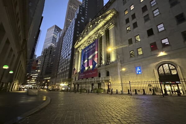 A banner for LATAM Airlines hangs from the front of the New York Stock Exchange on Tuesday, Oct. 22, 2024, in New York. (AP Photo/Peter Morgan)