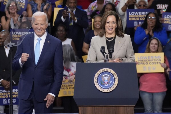 FILE - President Joe Biden, left, and Vice President Kamala Harris speak in Largo, Md., Aug. 15, 2024. (AP Photo/Stephanie Scarbrough, File)