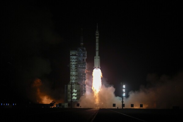 A Long March rocket carrying a crew of Chinese astronauts in a Shenzhou-18 spaceship lifts off at the Jiuquan Satellite Launch Center in northwestern China, Thursday, April 25, 2024. (AP Photo/Andy Wong)