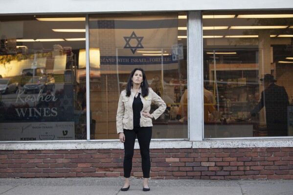 Rona Kaufman, a self-described progressive who is conflicted over who she will vote for in the presidential election, poses for a portrait in Squirrel Hill, a heavily Jewish neighborhood in Pittsburgh, Saturday, Oct. 20, 2024. (AP Photo/Rebecca Droke)