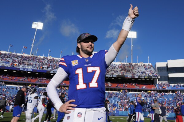 Buffalo Bills quarterback Josh Allen (17) celebrates the team's win after an NFL football game against the Tennessee Titans, Sunday, Oct. 20, 2024, in Orchard Park, N.Y. (AP Photo/Charles Krupa)