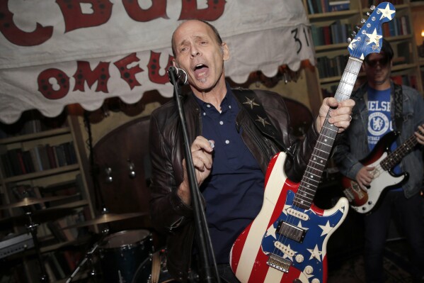 FILE - Wayne Kramer, co-founder of the protopunk Detroit band the MC5, performs at the after party for the CBGB West Coast Premiere Powered by Ciroc in Beverly Hills, Calif., on Oct. 1, 2013. (Photo by Todd Williamson/Invision for Ciroc/AP, File)