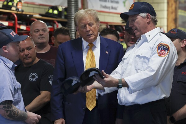 Former President Donald Trump meets with firefighters at a midtown Manhattan firehouse,Thursday, May 2, 2024, in New York. (AP Photo/Yuki Iwamura)