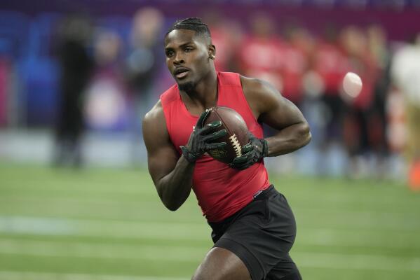 FILE - Michigan State wide receiver Jayden Reed runs a drill at the NFL football scouting combine in Indianapolis, March 4, 2023. The Green Bay Packers got a couple weapons for new starting quarterback Jordan Love by selecting Oregon State tight end Luke Musgrave and Reed in the second round of the NFL draft on Friday, April 28, 2023. (AP Photo/Michael Conroy, File)