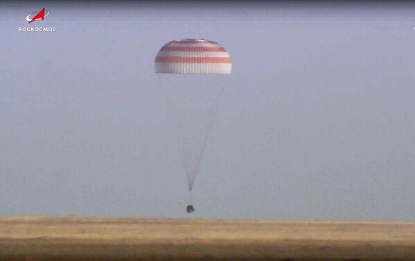 In this photo taken from video released by Roscosmos space corporation, Russian Soyuz MS-25 space capsule carrying the NASA astronaut Tracy Dyson and the Roscosmos cosmonauts Oleg Kononenko and Nikolai Chub lands south-east of the Kazakh town of Zhezkazgan, Kazakhstan, Monday, Sept. 23, 2024. (Roscosmos space corporation via AP)