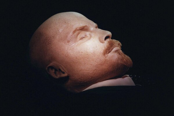 FILE - The embalmed body of Vladimir Lenin, the founder of the Soviet Union, is seen on display in his mausoleum on Moscow's Red Square, Russia, on Wednesday, April 16, 1997. This year marks the 100th anniversary of his death. While he remains lauded by Communists with his body still on view, he is more of a curiosity than a leading force in Russia. (AP Photo/Sergei Karpukhin, File)