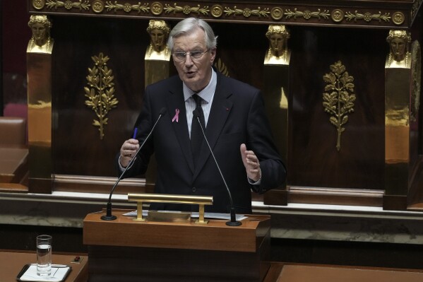 France's Prime Minister Michel Barnier gestures as delivers a speech at the National Assembly, in Paris, Tuesday, Oct. 1, 2024. (AP Photo/Thibault Camus)