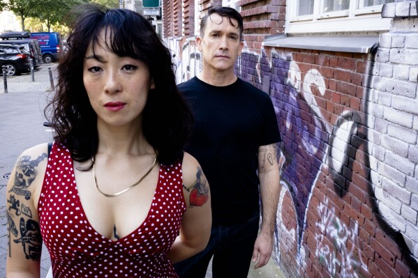 Angela Seo, left, and Jamie Stewart of the band Xiu Xiu pose for a portrait in Berlin, Germany, Wednesday, Aug. 28, 2024. (AP Photo/Markus Schreiber)