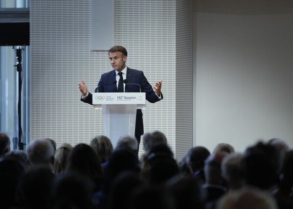 French President Emmanuel Macron speaks, during the IOC Session Opening Ceremony at the Louis Vuitton Foundation ahead of the 2024 Summer Olympics, Monday, July 22, 2024, in Paris, France. (AP Photo/Thibault Camus)